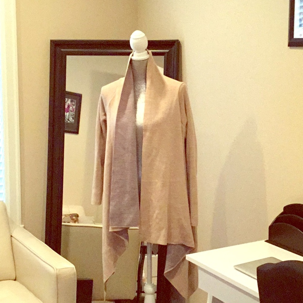 Tan open sweater.